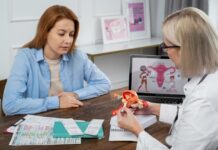 Cervical Screening: 10 Commonly Asked Questions Answered A doctor explaining the importance of cervical screening to a lady