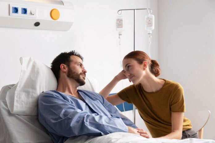 Wife sitting with sick husband | Concept for supporting a loved one diagnosed with Mesothelioma